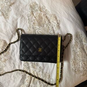 Black leather purse with gold hardware